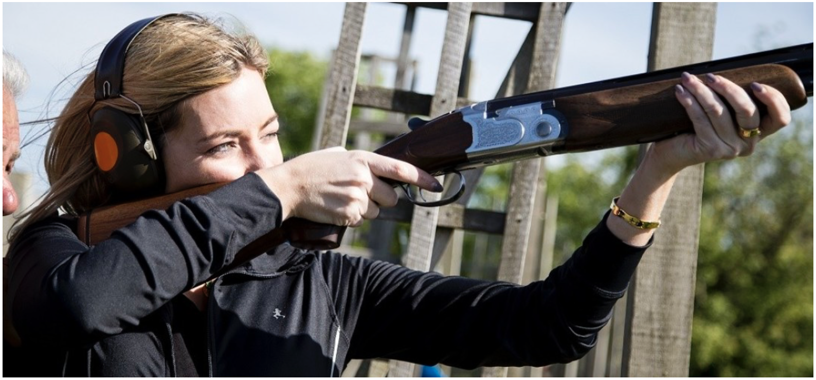 Lady shooting clays with a beretta 686s
